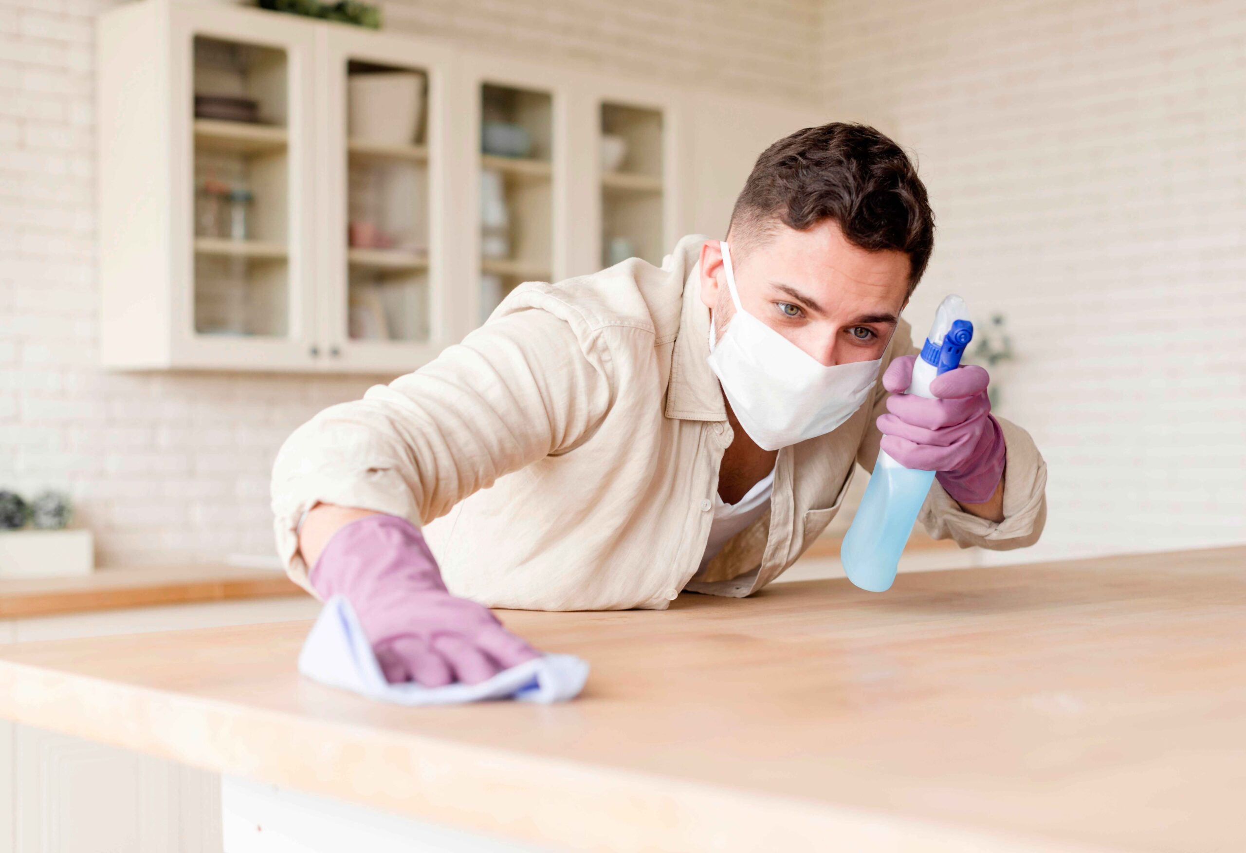 young-man-holding-disinfectant