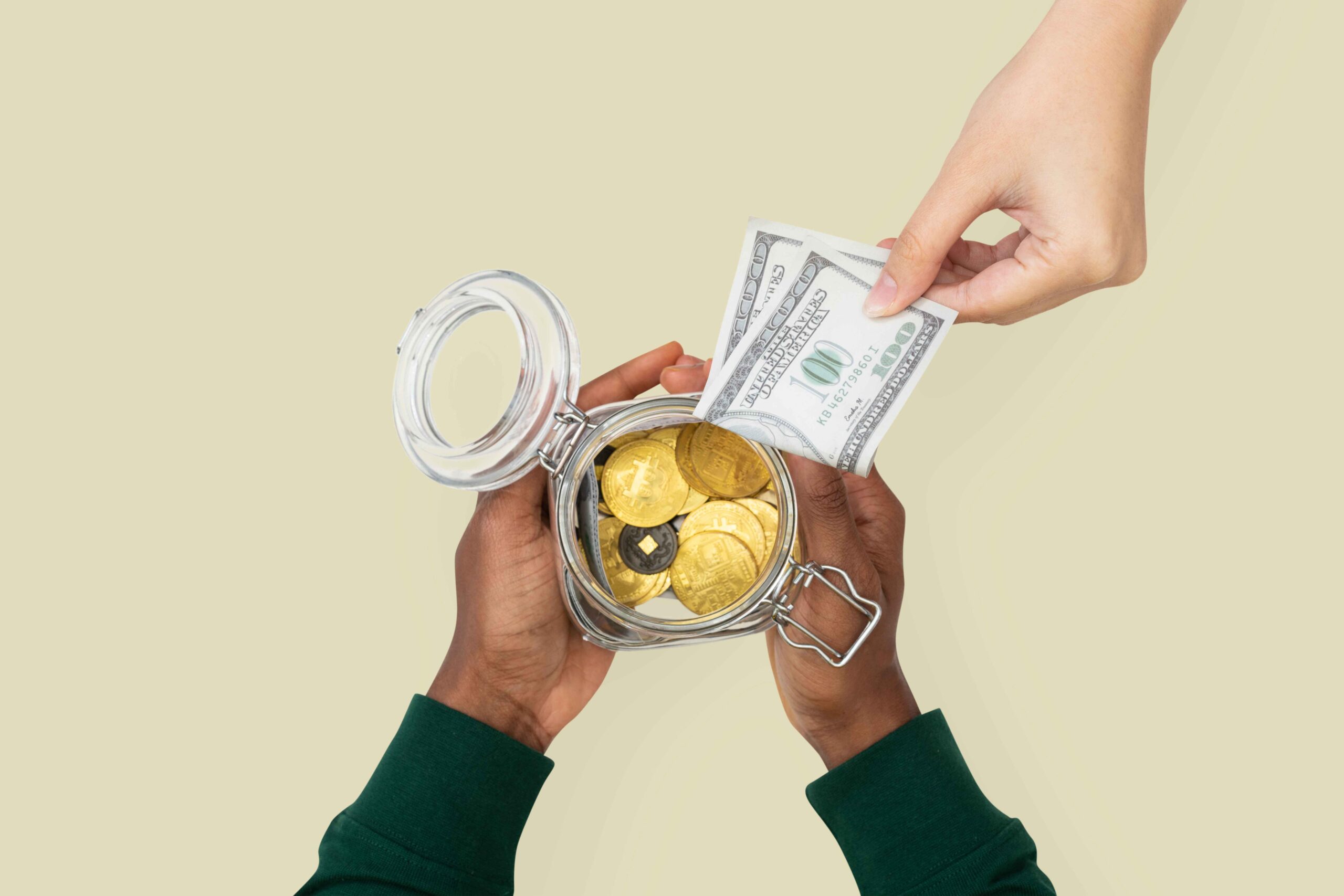 money-jar-held-by-hands-finance-savings-concept